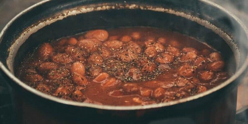 Baked beans recipe in black cooking pot